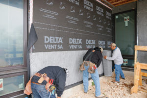 Applying a weather-resistive barrier