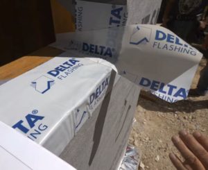 making a “dart” with DELTA®-FLASHING to cover the window corner
