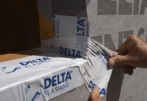 Covering the dart with one a piece of DELTA®-FLASHING
