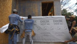 two men applying the DELTA®-VENT SA house wrap